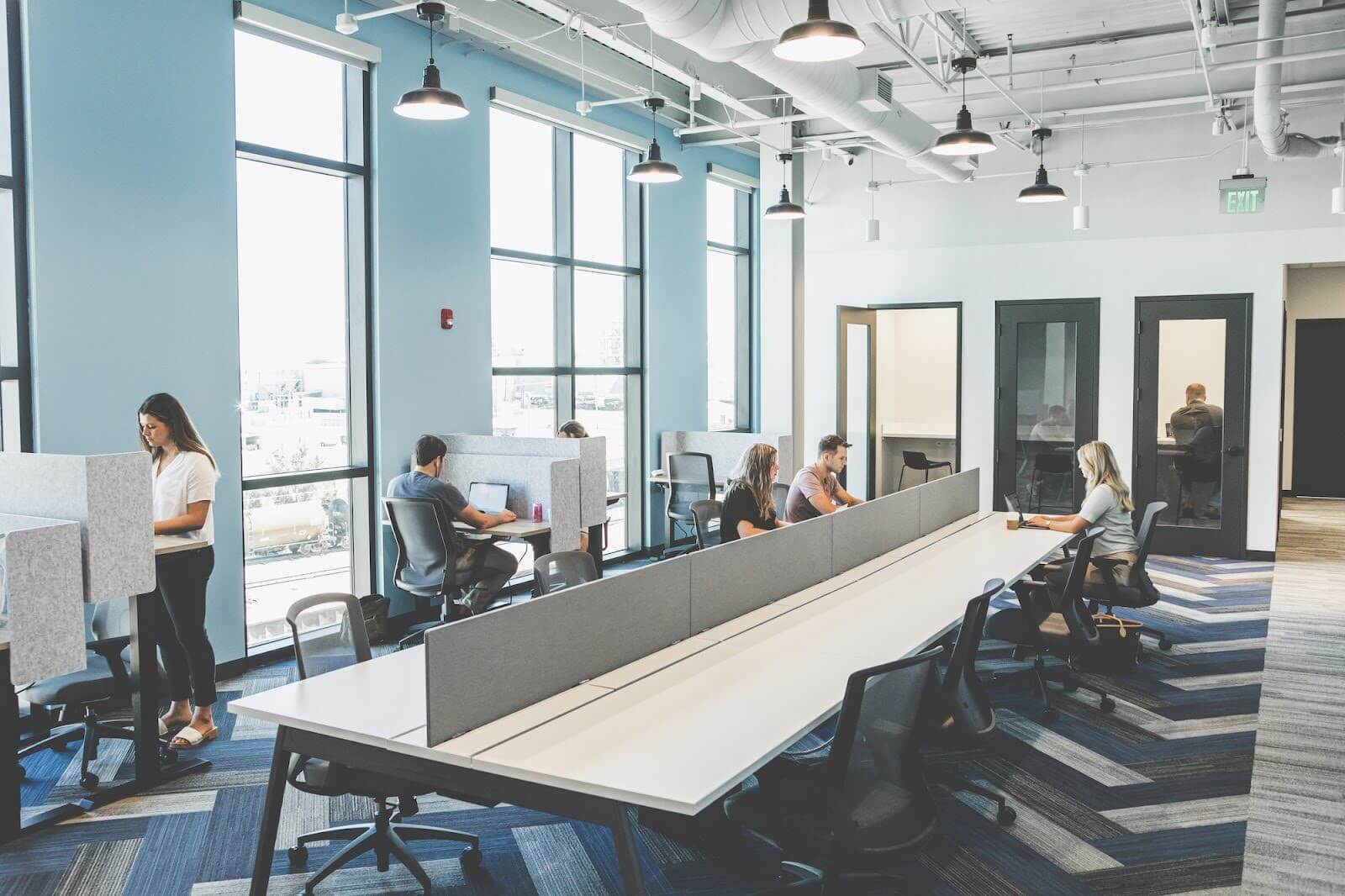 Young adults working in a collaborative workspace.